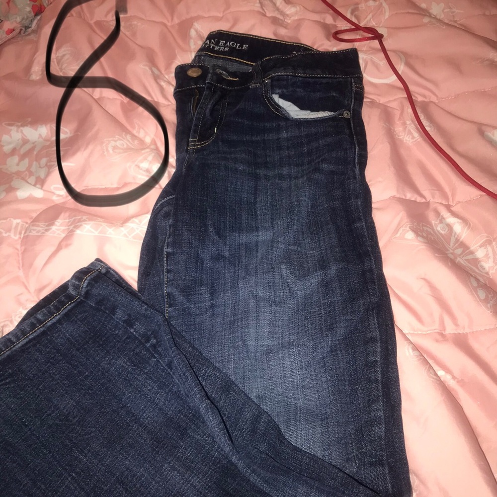 Two different brands of jeans one is American eagle size 8 the other is size 5
